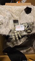 Furry white abominable snowman costume pieces and gloves in box