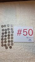 All 35 Mercury dimes arranged in grid next to lot card