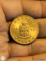 Obverse showing Quebec coat of arms, date 1867, brass finish