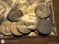 Bag containing nine Canadian 5-cent coins, various dates visible