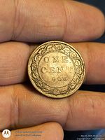 Reverse side showing ONE CENT 1906 within maple leaf wreath