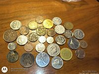 Full overview of all coins arranged on table, obverse sides visible