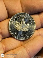 Obverse maple leaf side with title text visible