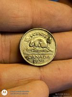 Reverse of 1938 Canadian 5-cent coin showing beaver and date