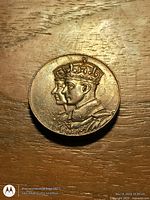 Obverse of the coin showing crowned busts of King George VI and Queen Elizabeth