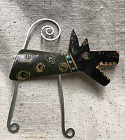 front view showing painted design, legs, tail