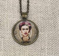 Front view of pendant showing Frida Kahlo portrait and bronze-tone bezel