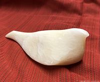 Top view of cream stone dove sculpture