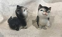 Front view of both kitten shakers showing glaze and painted details