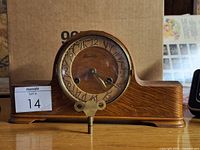 Front view of Forestville wooden mantel clock displaying dial and case