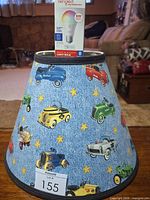 Lamp shade with car pattern and Sengled bulb box displayed on top