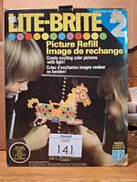 Front of Lite-Brite refill box showing children and horse design