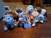 Group shot of six Coca-Cola International Collection plush dogs