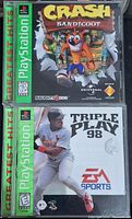 Front covers of Crash Bandicoot and Triple Play 98 PlayStation 2 Greatest Hits games in cases