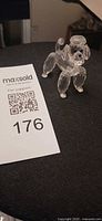 Front angled view of clear faceted crystal poodle figurine