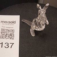 Front angled view of clear faceted crystal kangaroo with joey