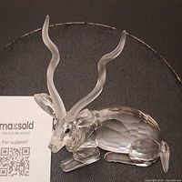 Left front view showing crystal facets and horns