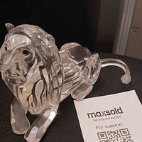 Front angle of Swarovski crystal lion figurine showing mane and facial features