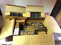 Open carton showing multiple American Flyer boxes, track bundles and accessories