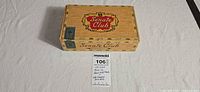 Closed natural wood Senate Club cigar box showing exterior graphics