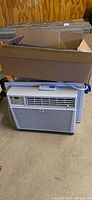 Air conditioner with side panels and box