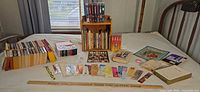 Overview of paperbacks, bookshelf, cassettes, bookmarks, yardstick