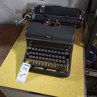 Front angled view of Royal portable typewriter showing full keyboard, carriage, and overall condition