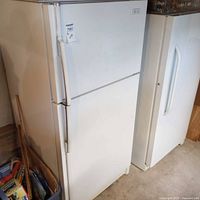 Front view of white Maytag top-freezer refrigerator