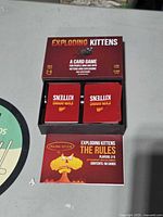 Open box showing two decks and rules