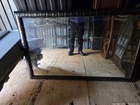 Full view of rectangular mirror with black frame