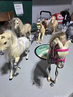 Group of plastic horses on tabletop
