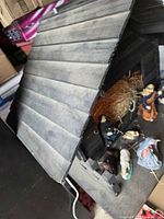 Overall view of wooden stable roof and figurines