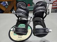 Front view of both bindings showing straps and footbeds