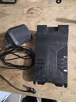 Battery pack and charger cord side by side