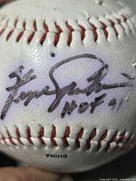 Close-up of Fergie Jenkins signature and HOF 91 inscription on baseball