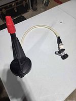 Full view of Vitamix Rinse-O-Matic showing base, nozzle and hose