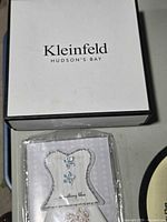 Closed Kleinfeld Hudson’s Bay box and packaged handkerchief