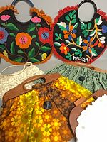 Group view of all six handbags showing designs and handles