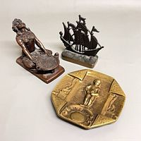 Group shot of incense burner, ashtray and ship figurine