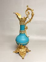 Full view of turquoise porcelain ewer with gilt bronze mounts