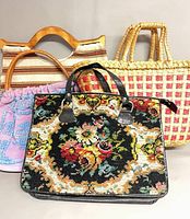 Group shot of all four handbags front view