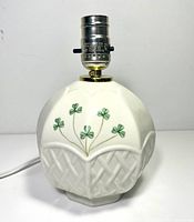Full view of Belleek porcelain shamrock lamp base with socket and cord