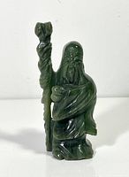 Front view of green jade figurine