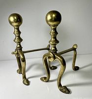 Pair of brass andirons front angle