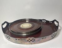 Both trays showing size comparison and oval tray rim details