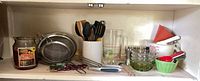 Full view of cupboard shelf showing majority of items