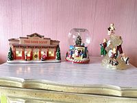 Group view of all three holiday figurines on dresser