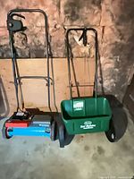Gardena scarifier and Scotts drop spreader side by side