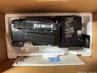 Camcorder in Styrofoam packing inside box