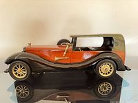Left side view of wooden vintage model car